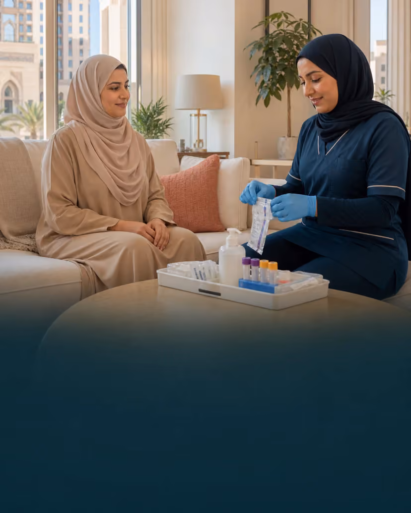 Healthcare professional preparing a home blood-test collection with an adult patient in Sharjah